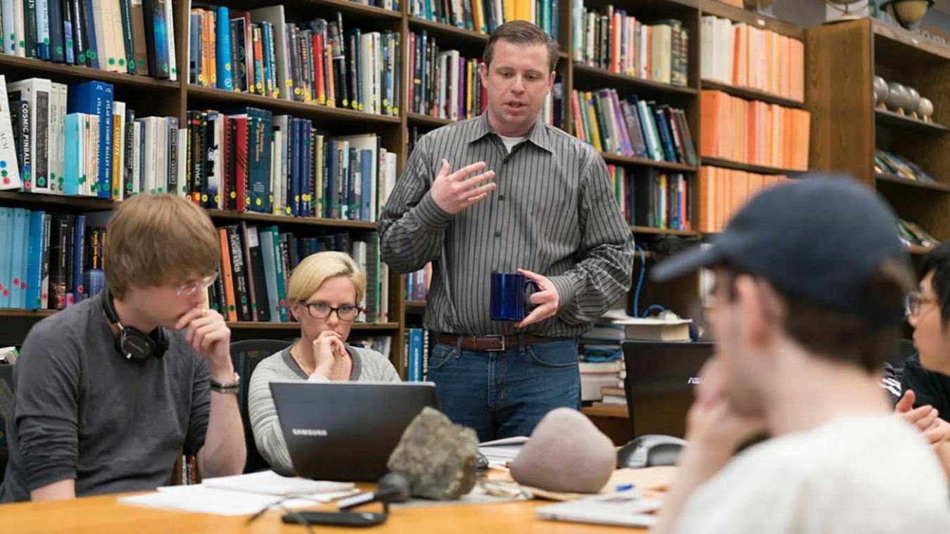 Professor Alex Hayes with astronomy students