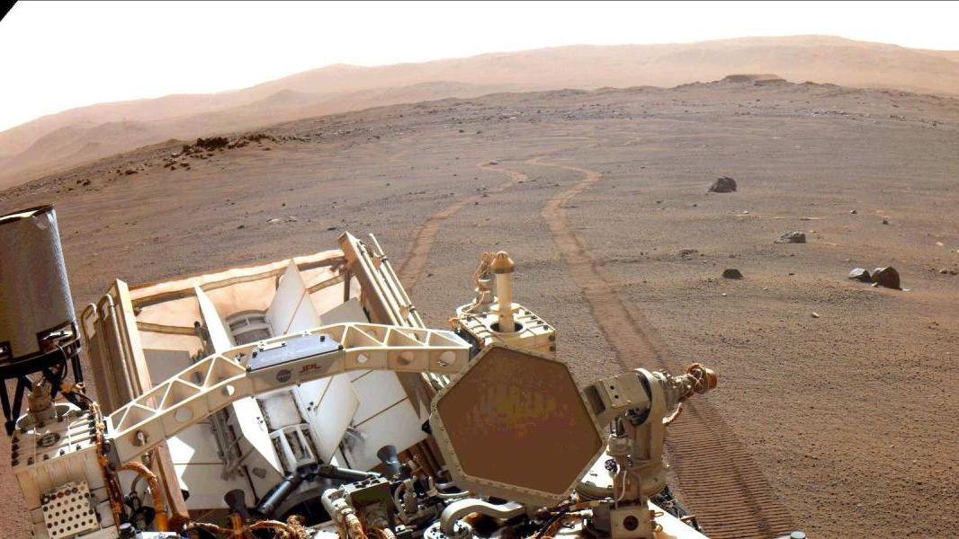 Persevereance looks back at wheel tracks