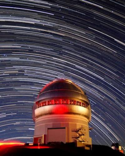 Telescope framed by stars